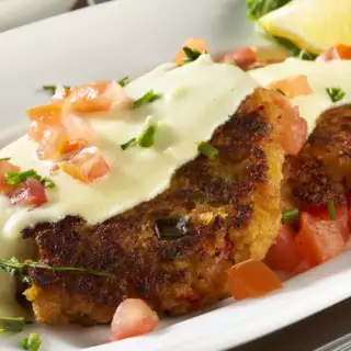 Two homemade shrimp cakes topped with our rich lemon-butter sauce.