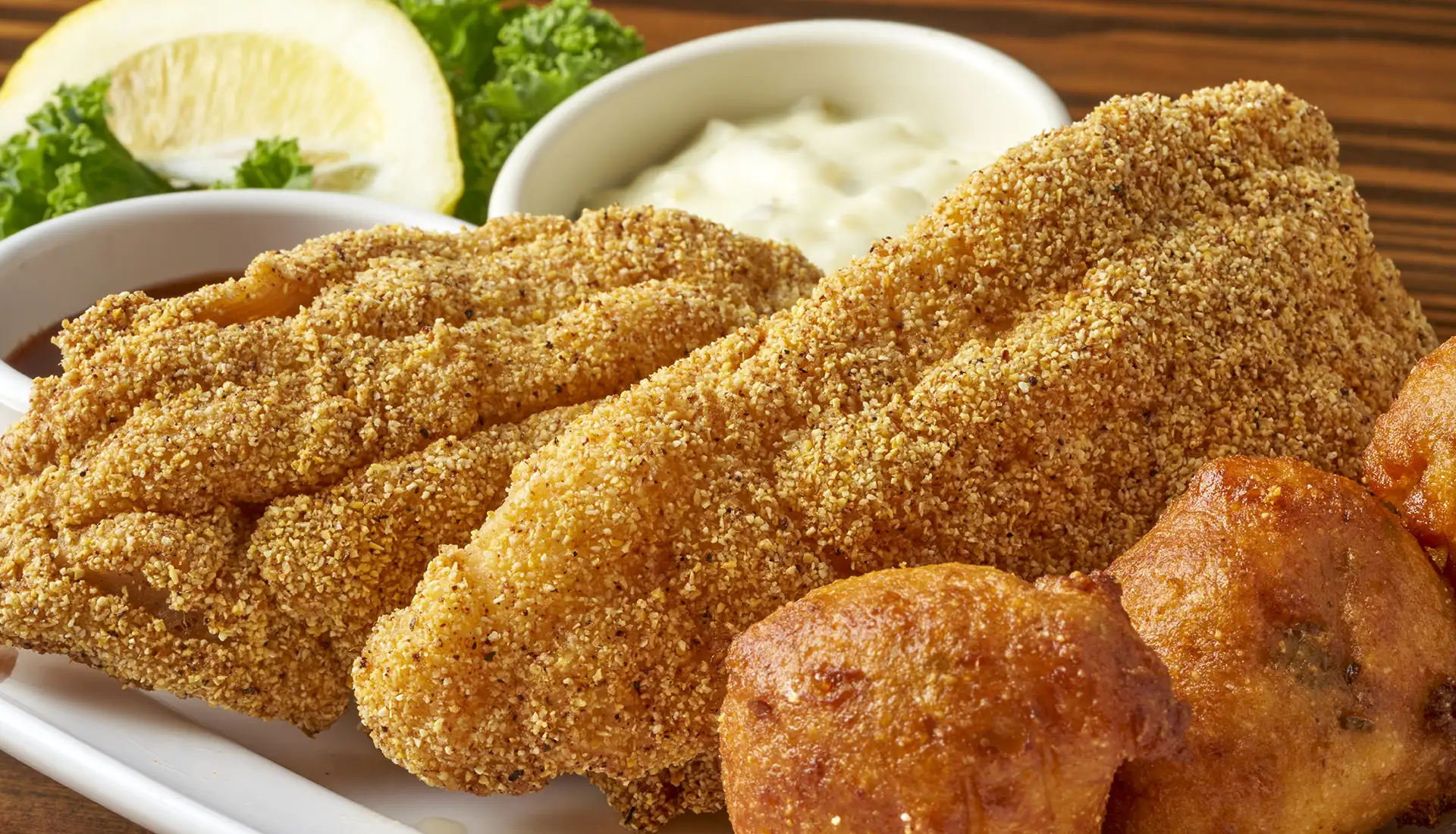 Farmed raised catfish lightly breaded in our corn meal. Served with two sides dishes.
