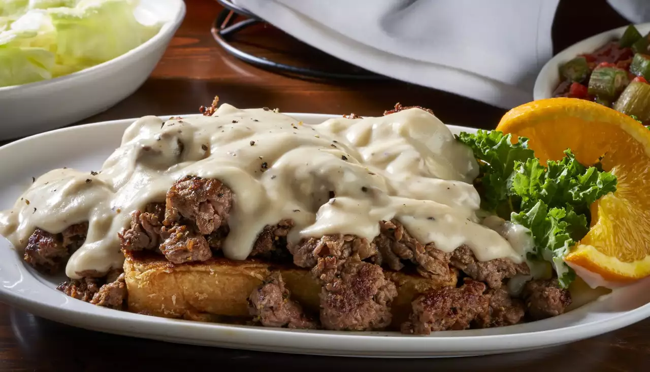 Thinly sliced and grilled Ribeye steak served on Texas Toast and smothered with bacon gravy made from scratch. Served with two sides of your choice.