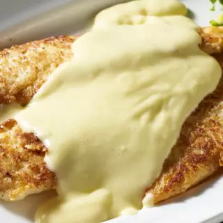 A lightly breaded flounder filet sautéed and served in a lemon-butter sauce with two sides.
